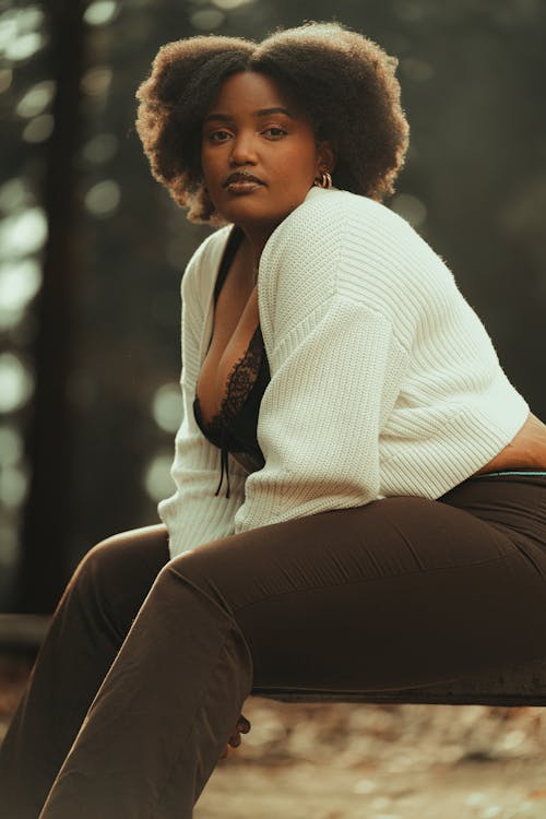 Woman with Curly Hair Sitting