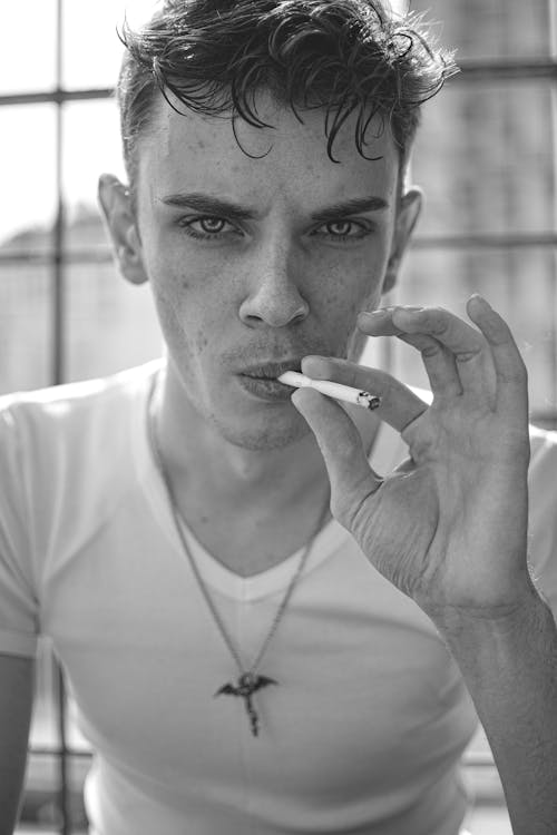 Young Man Smoking a Cigarette 