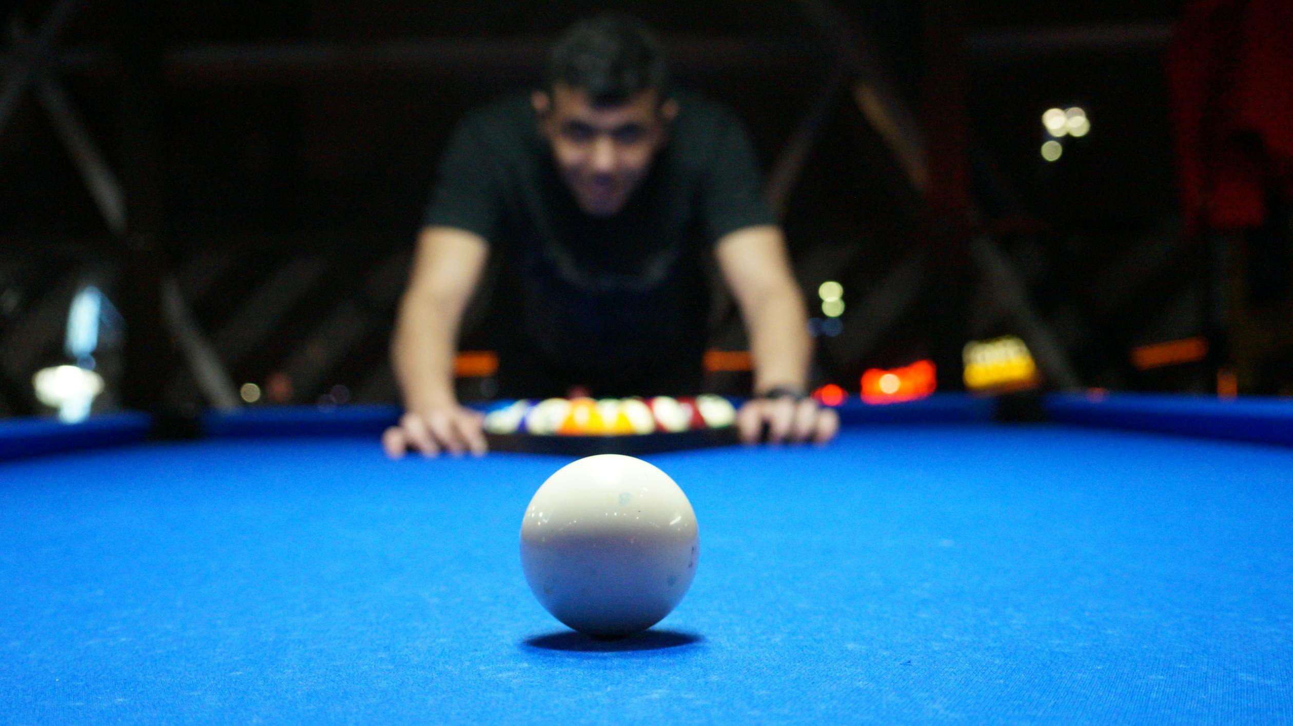 A man playing billiard.