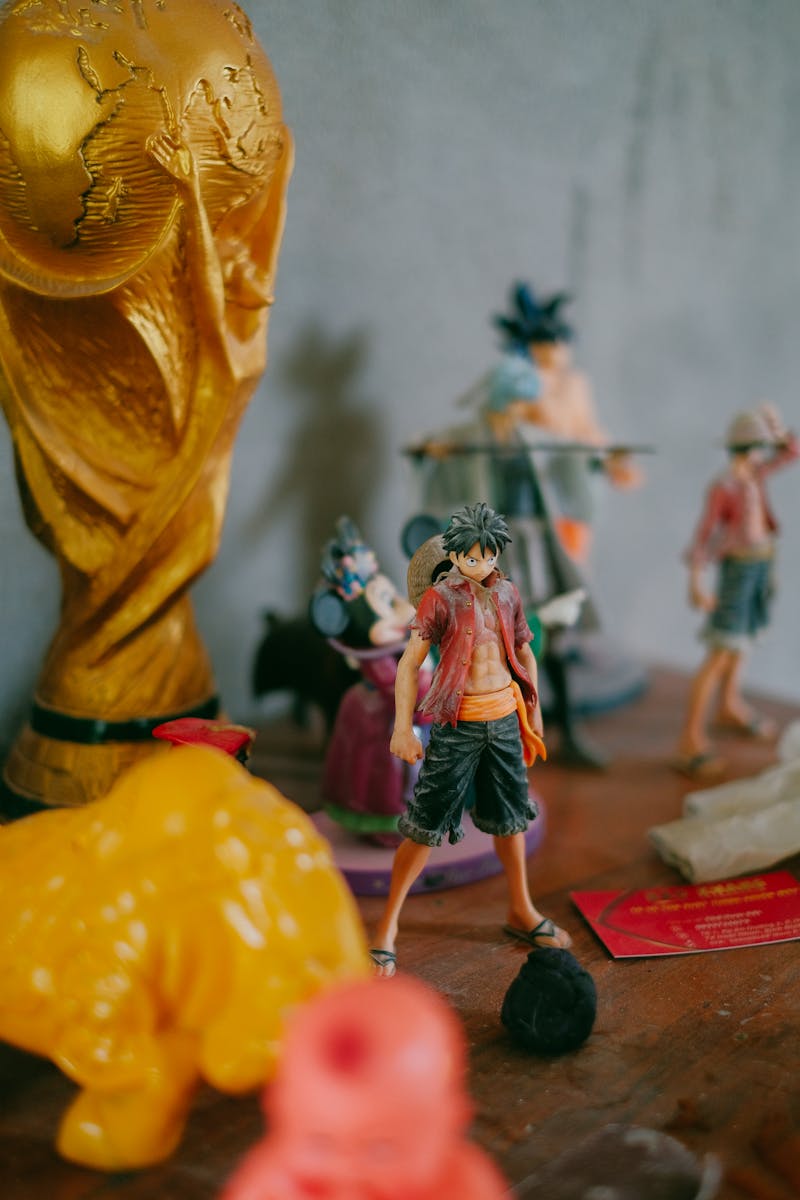 Anime figures displayed on a collector shelf