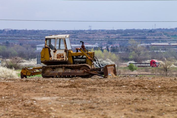 Bulldozer on a cleared dirt lot