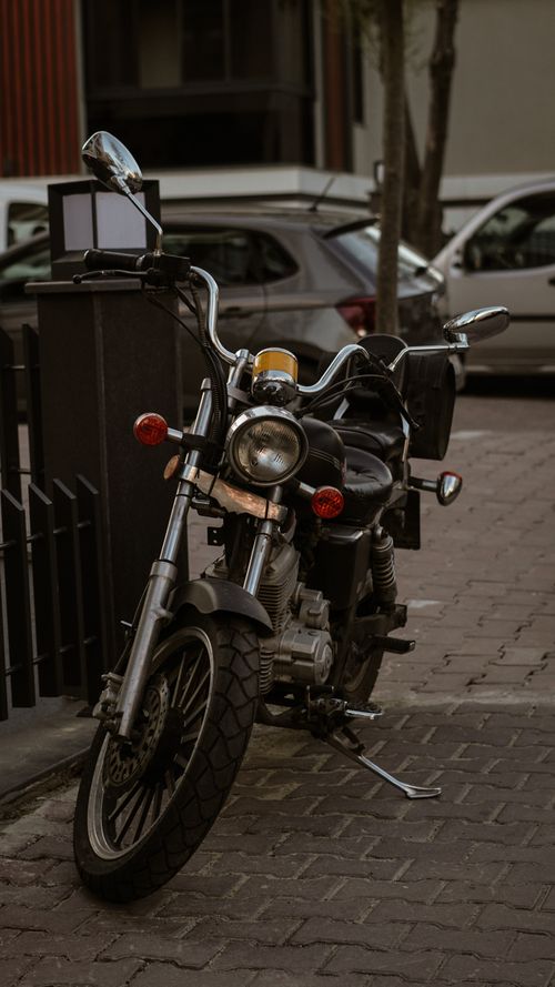 Free A classic vintage motorcycle parked on a street in Istanbul, showcasing retro design and chrome details. Stock Photo