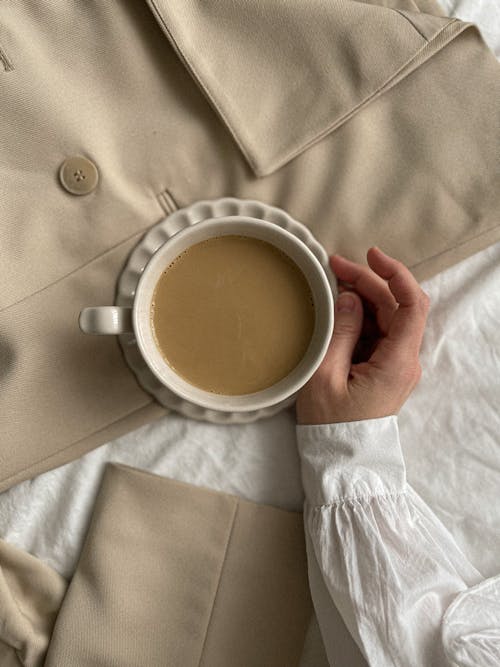 Hand and Coffee Cup