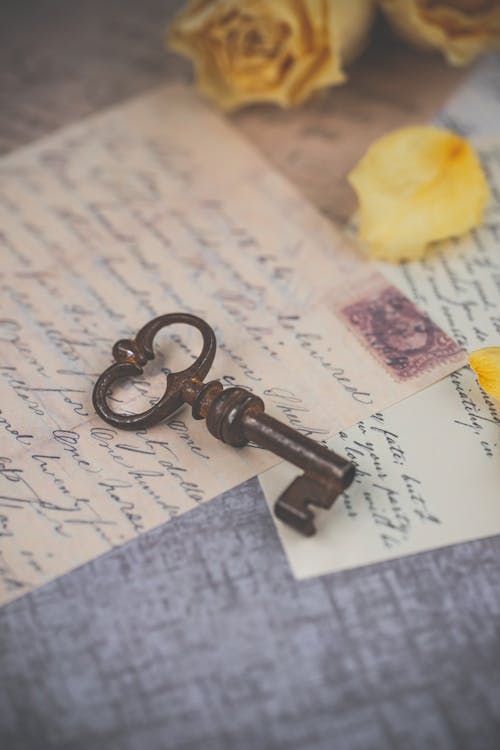 Free Key on Old Letters Stock Photo