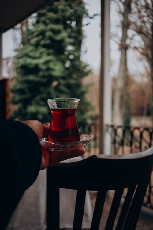 Hand Holding Turkish Tea