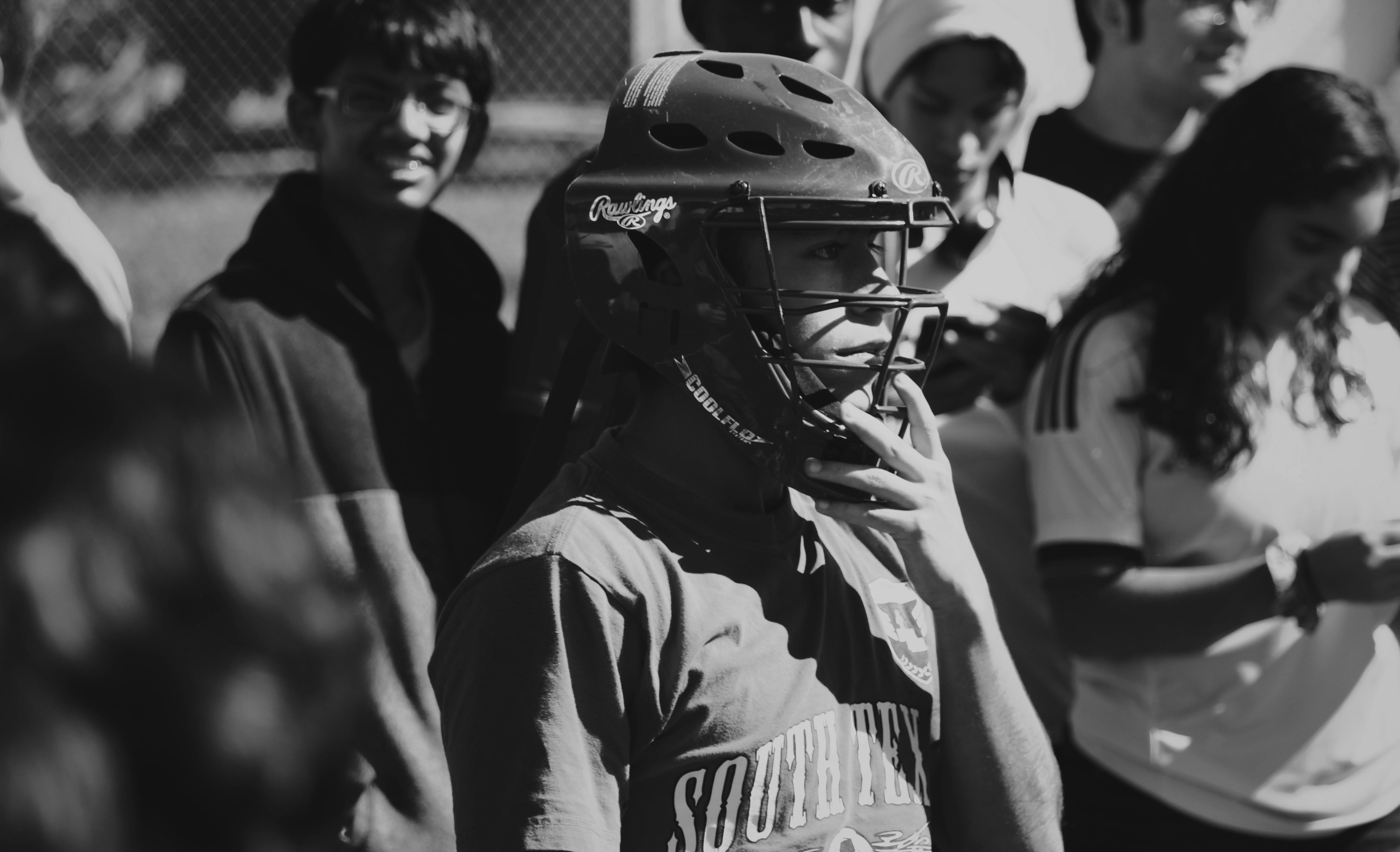 grayscale photo of man wearing helmet