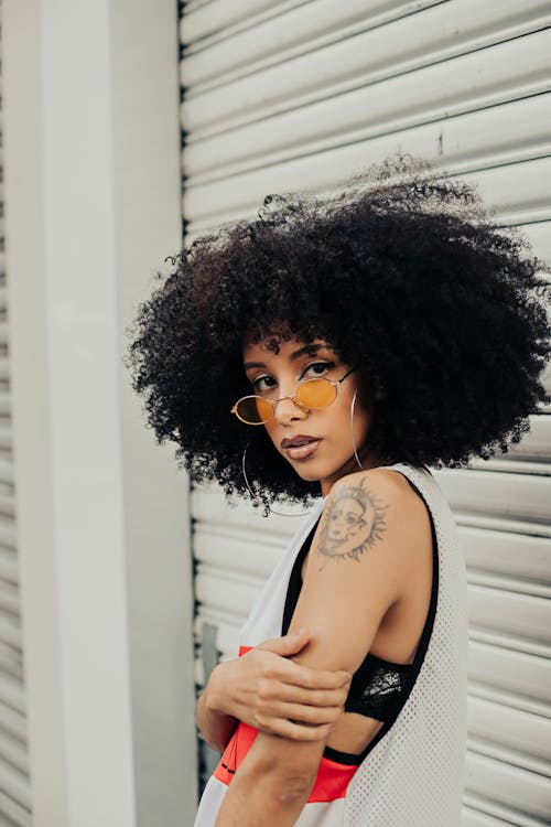 Woman with Afro and Tattoo