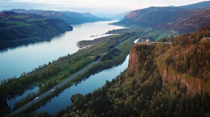 Aerial view of the Columbia River Gorge, river, basalt walls, and old-growth fir canopy