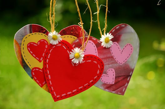 Three Red Hearts Hanging With White Flowers