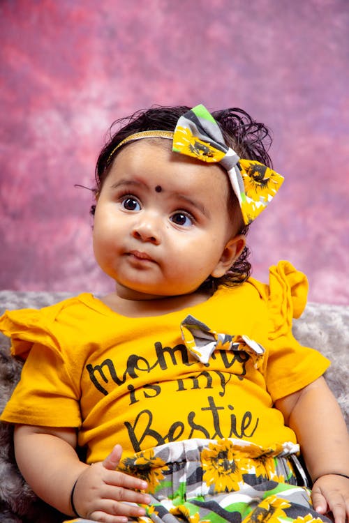 A Little Girl with a Hair Bow and a Yellow T-shirt 