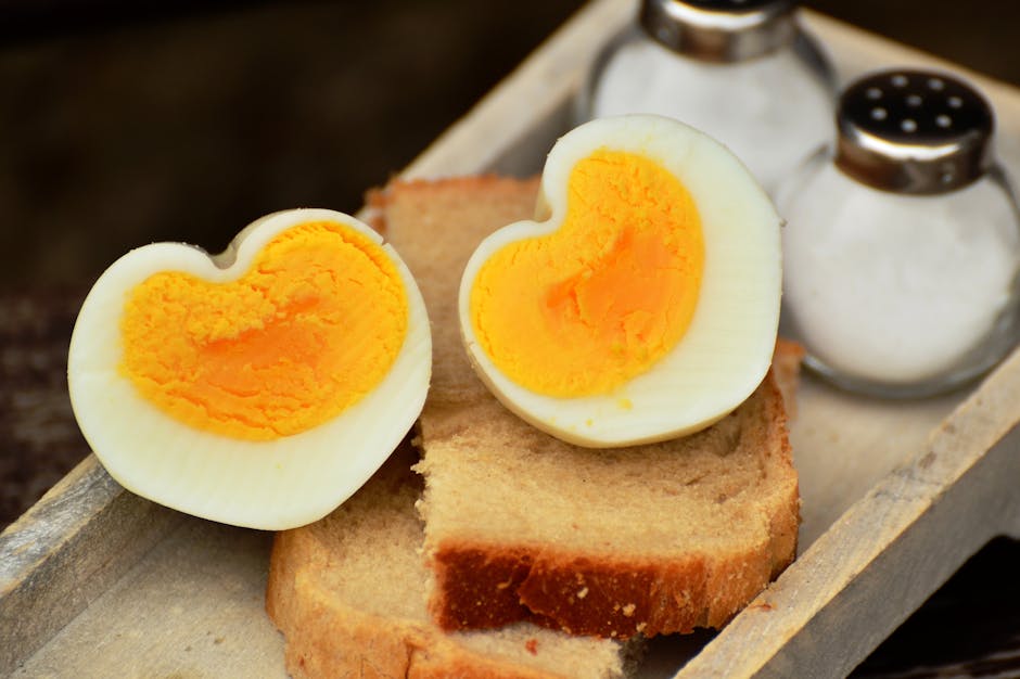 Boiled Egg on Top on Bread Beside Salt Shaker