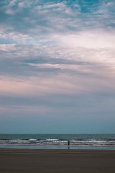 Calm sunset at Ormara Beach, Balochistan, Pakistan with tranquil waves and moody sky.