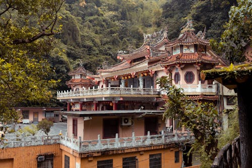 A Traditional Buddhist Temple in a Forest in Mountains 