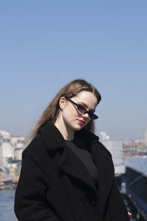 Woman Posing in Sunglasses and Black Clothes