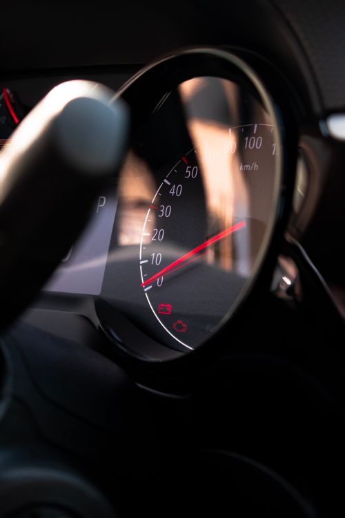 Free Close-up view of a car speedometer with light reflections on the dashboard. Stock Photo