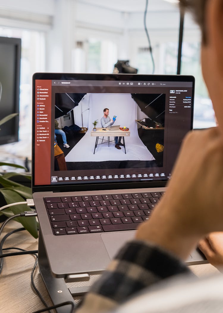 Man Editing A Video On A Laptop 