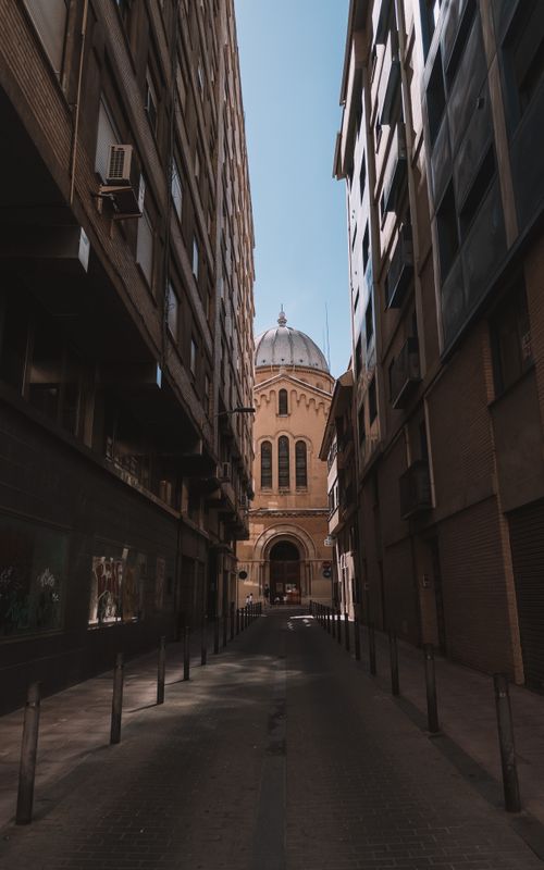 Free Discover a charming alleyway leading to a historic building in Castellón de la Plana, Spain. Stock Photo