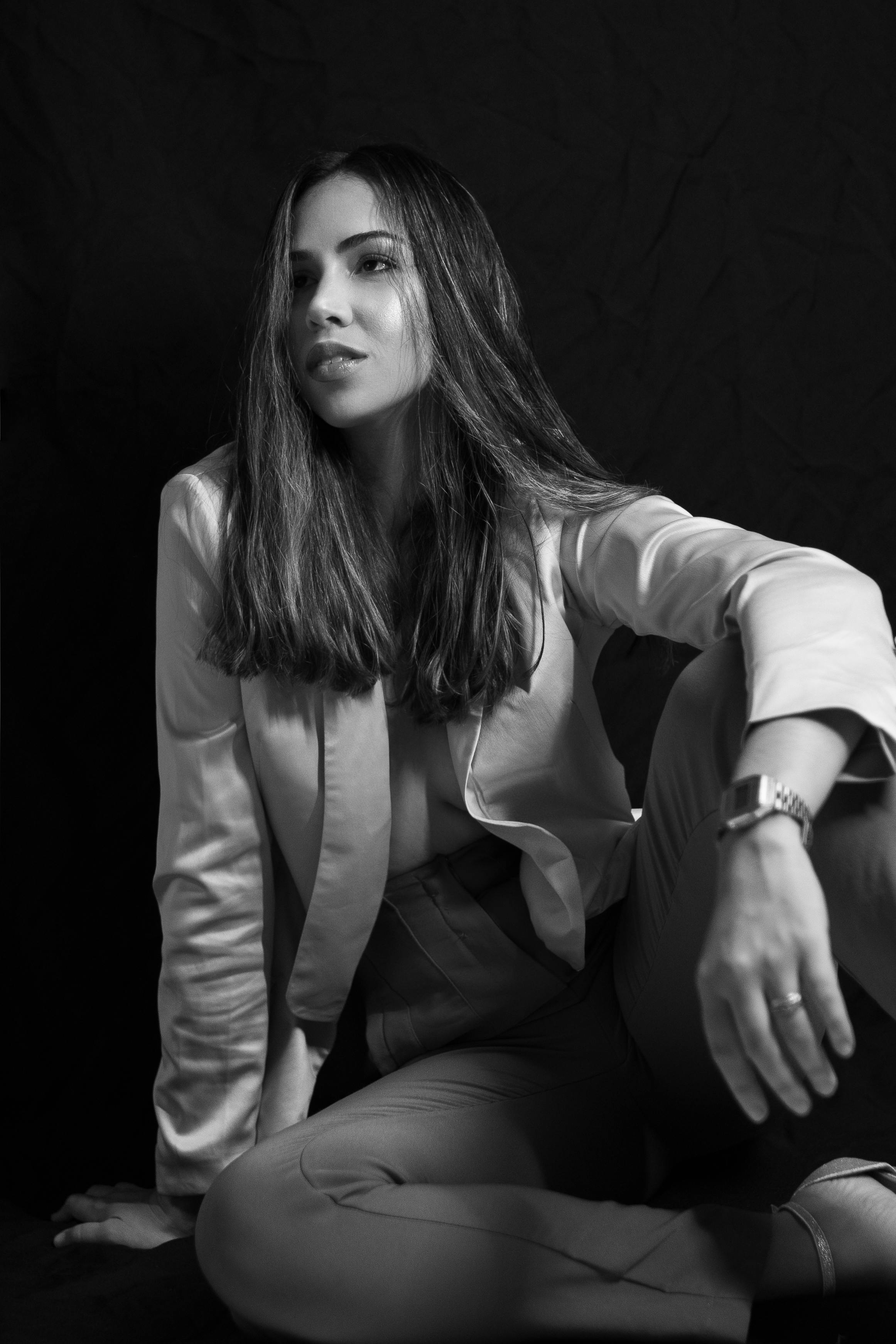 Sleek and chic: A young black woman poses in a fashionable white t