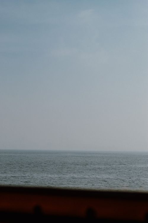 Free Peaceful ocean scene with blue sky and horizon. Stock Photo