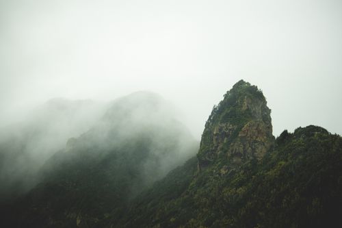 Free Ethereal mist envelops rugged green mountains in the Spanish countryside. Stock Photo