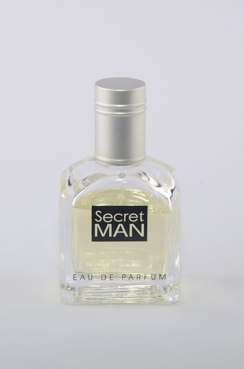 Free A stylish men's cologne bottle on a simple white backdrop, exuding elegance. Stock Photo
