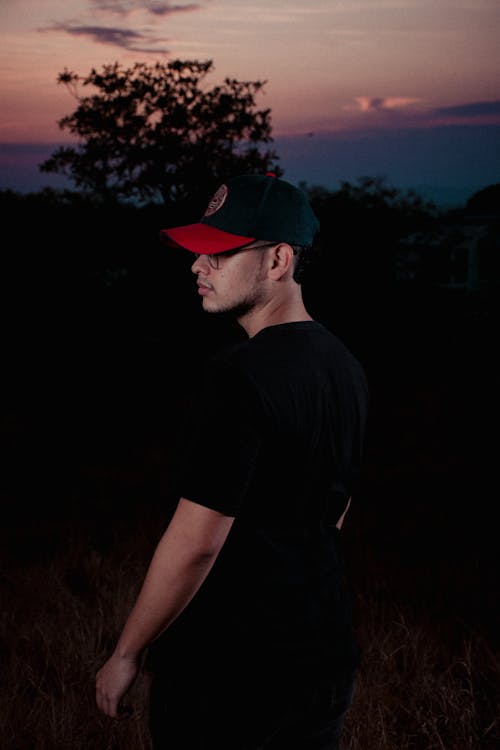 Man in a Cap Standing in a Field