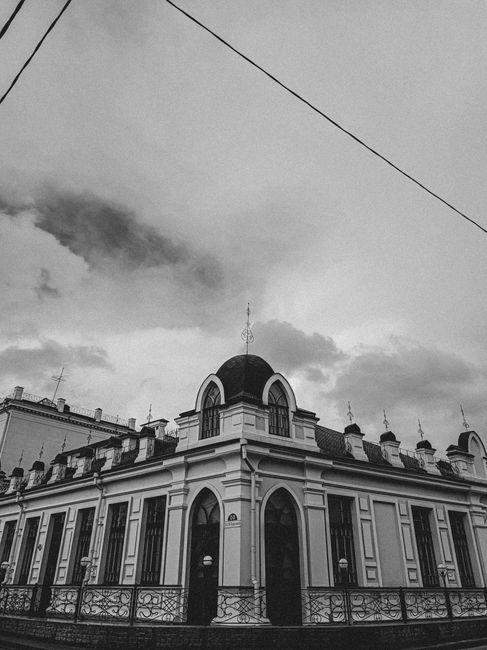 Black and white photo capturing the historic Polesskiy Drama Theater in Pinsk, Belarus.