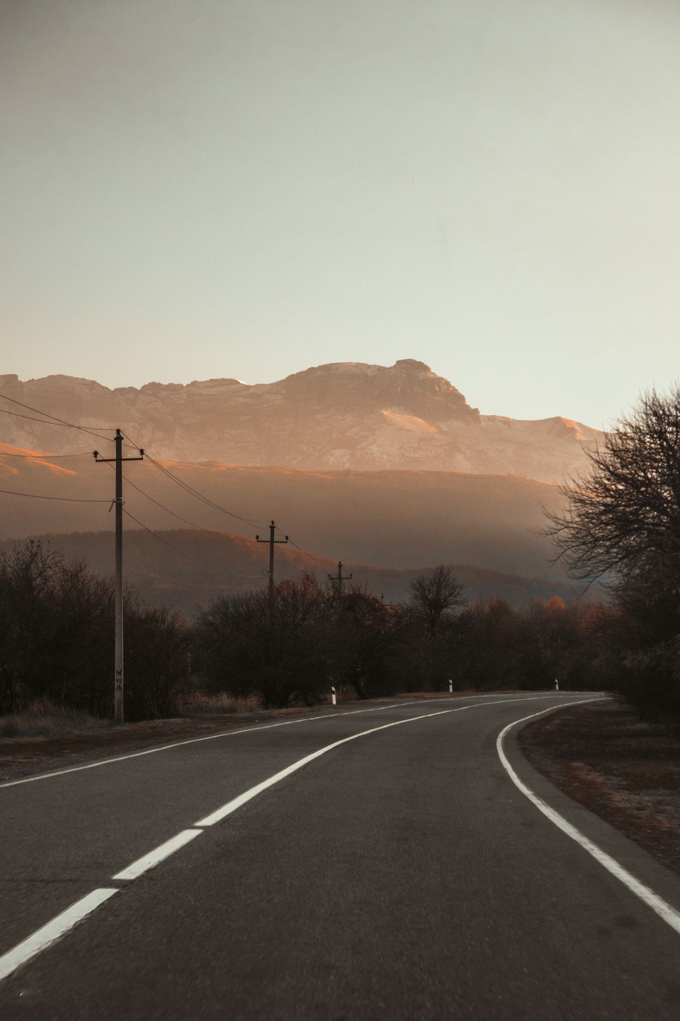 Winding mountain road in Georgia at sunset