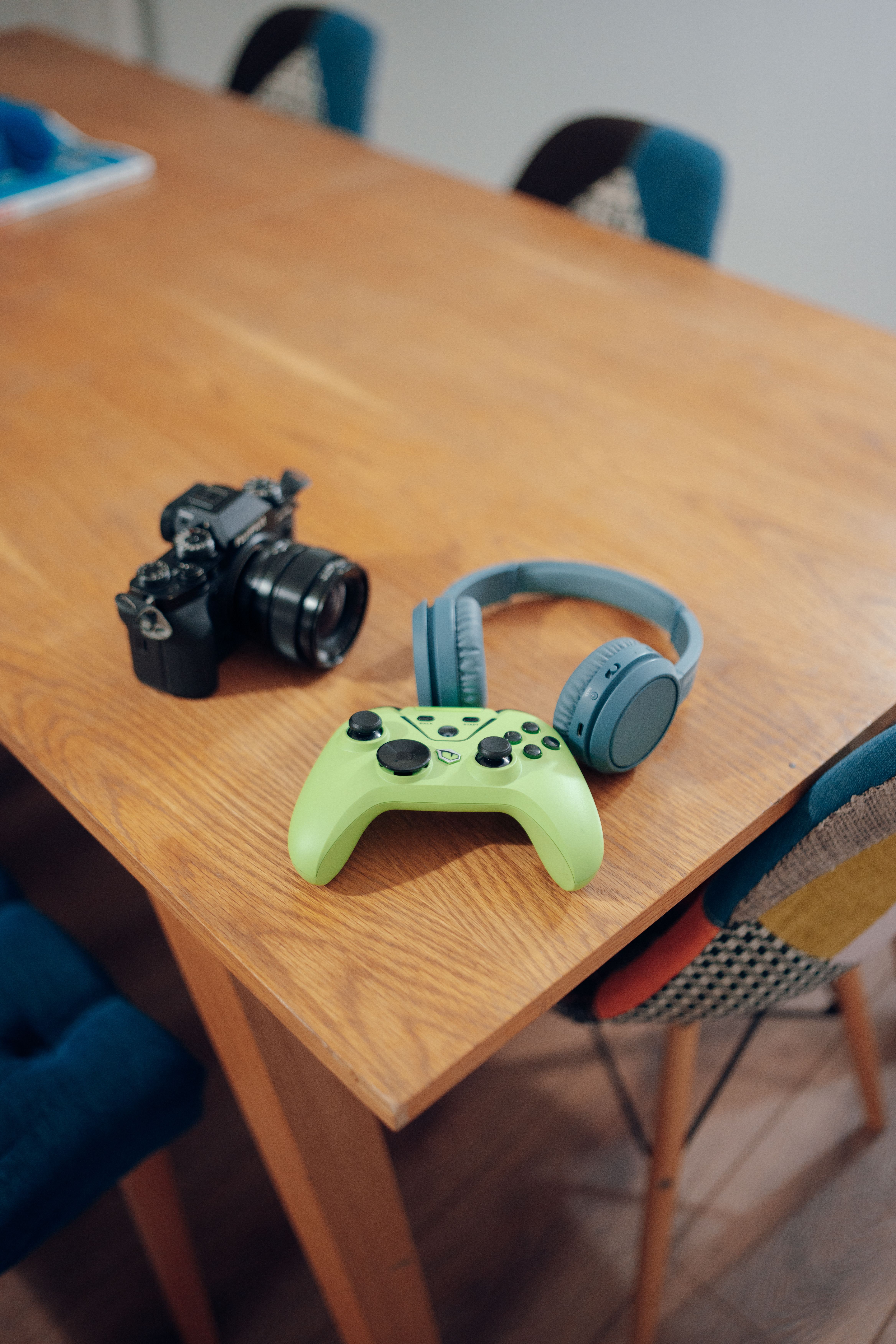 A Digital Camera, Headphones and a Gaming Controller on a Table · Free ...