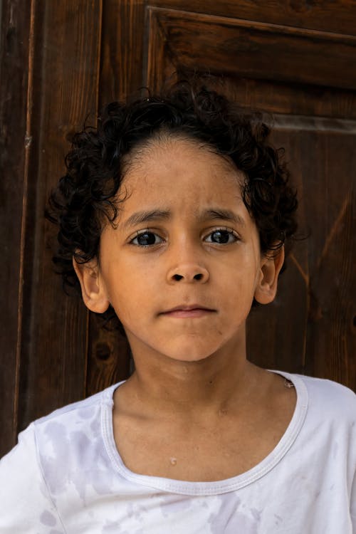 Free Portrait of a Young Boy with Dark Hair  Stock Photo