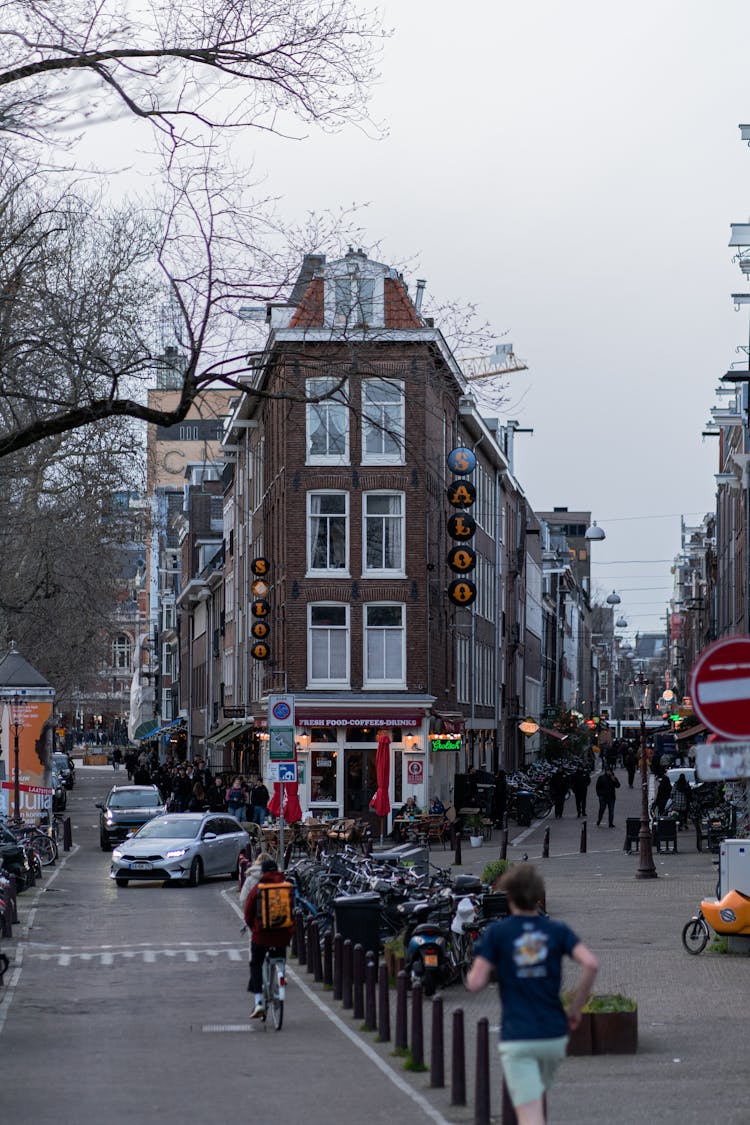 View On A Corner Building And People On The Street