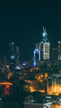 Stunning night view of İstanbul's illuminated cityscape with modern skyscrapers.