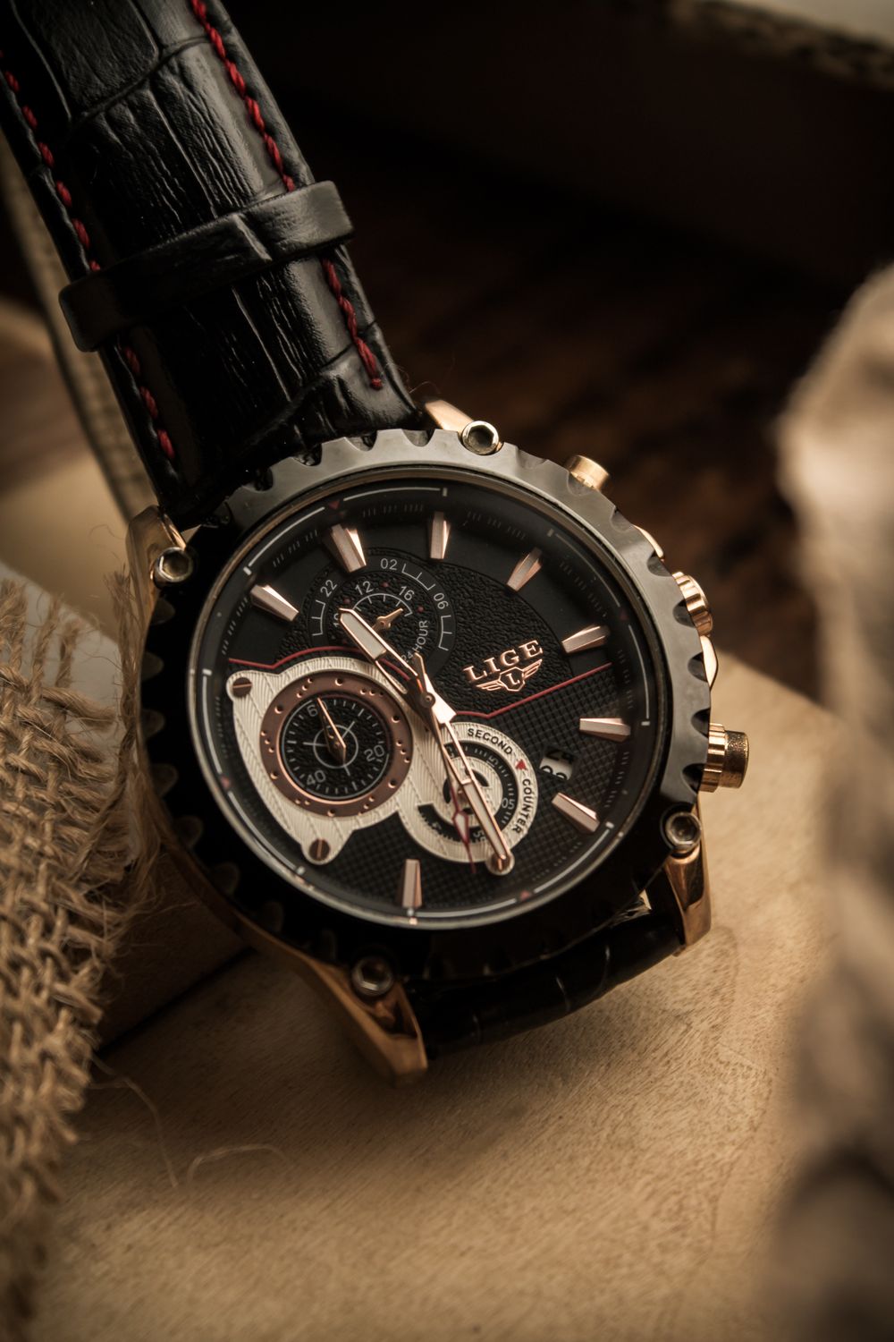 Intricate chronograph dial with black leather strap — Chronos collection