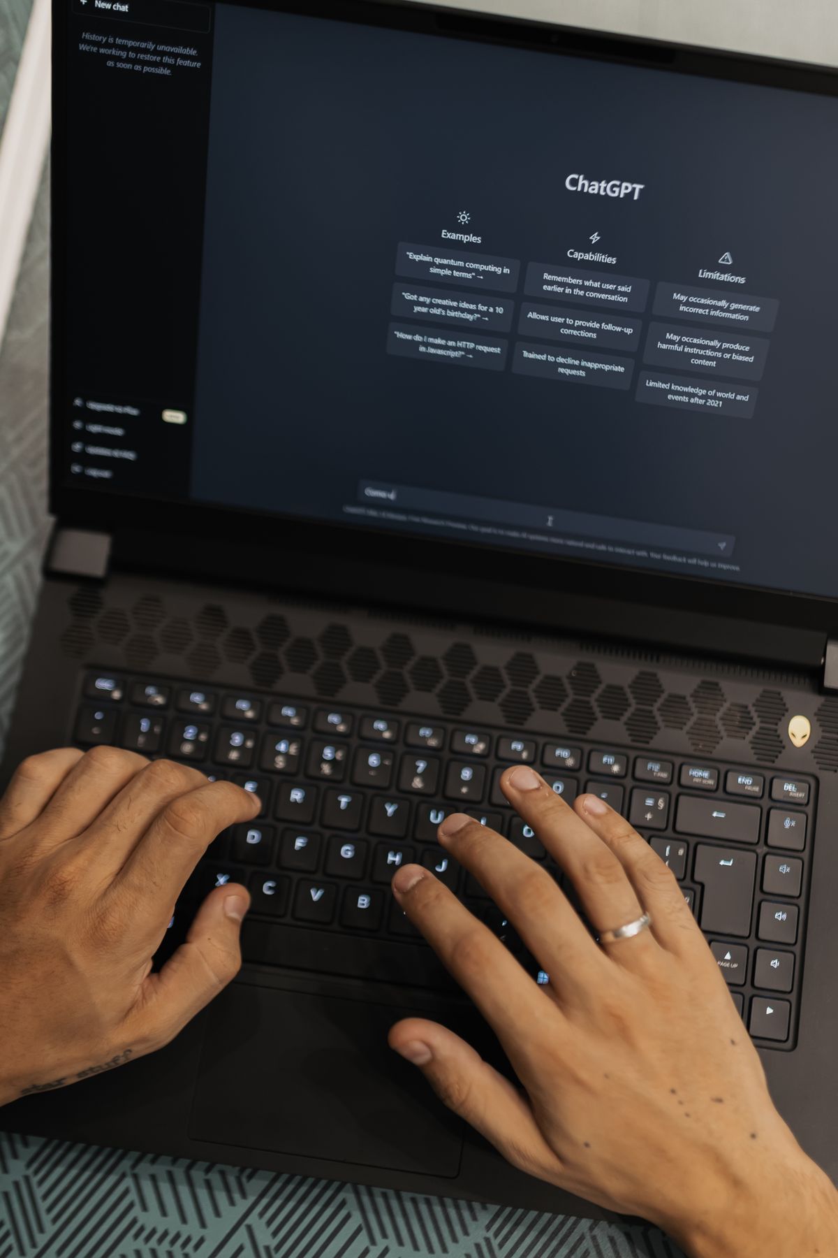 Generative Engine Optimization India: hands typing on a laptop showing the ChatGPT interface