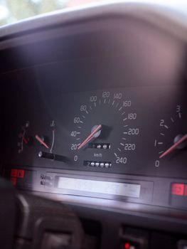 Detailed close-up of a car speedometer displaying kilometers per hour, highlighting vehicle performance.
