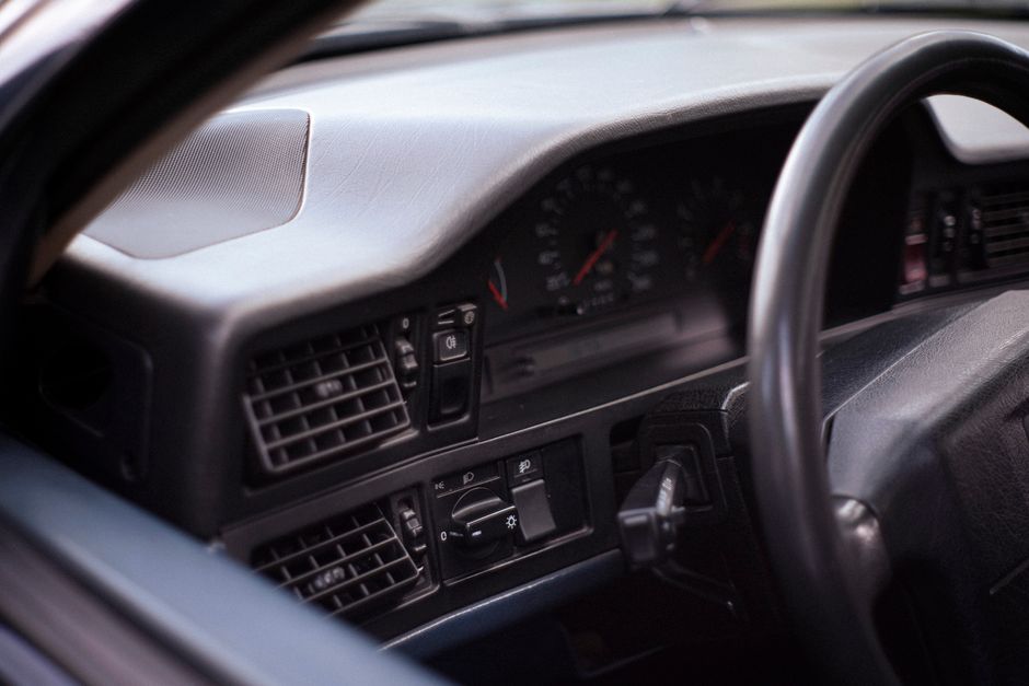 Photo by Mario Amé on Pexels Detailed view of a vintage car interior showcasing dashboard and steering wheel with analog speedometer.