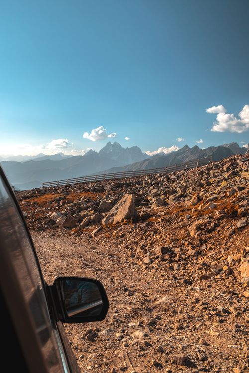 Free Explore the rugged mountain landscape of Georgia with a scenic drive under a clear blue sky. Stock Photo