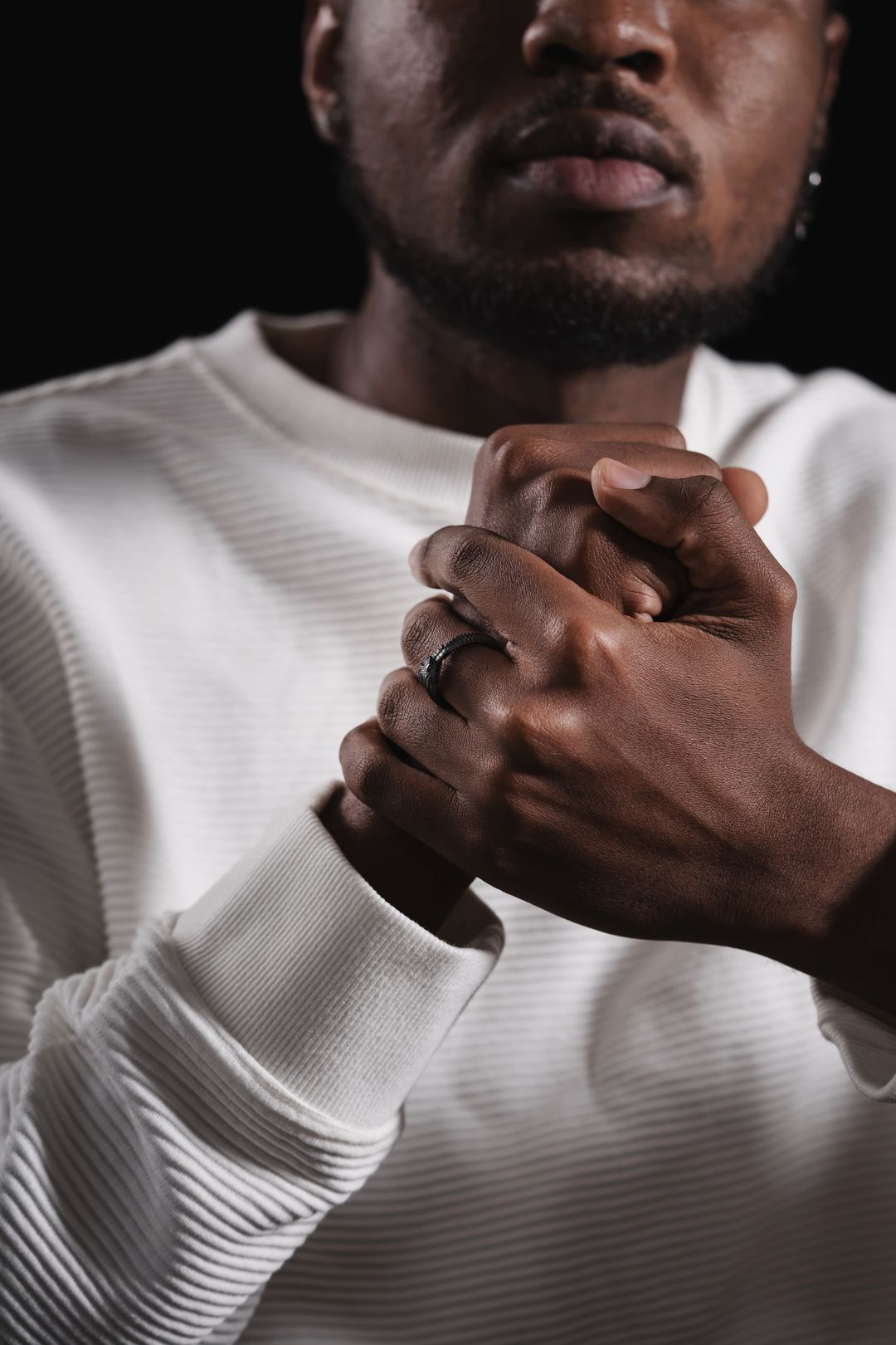 man wearing a plain black wedding band — best wedding band for men — FoundryCut