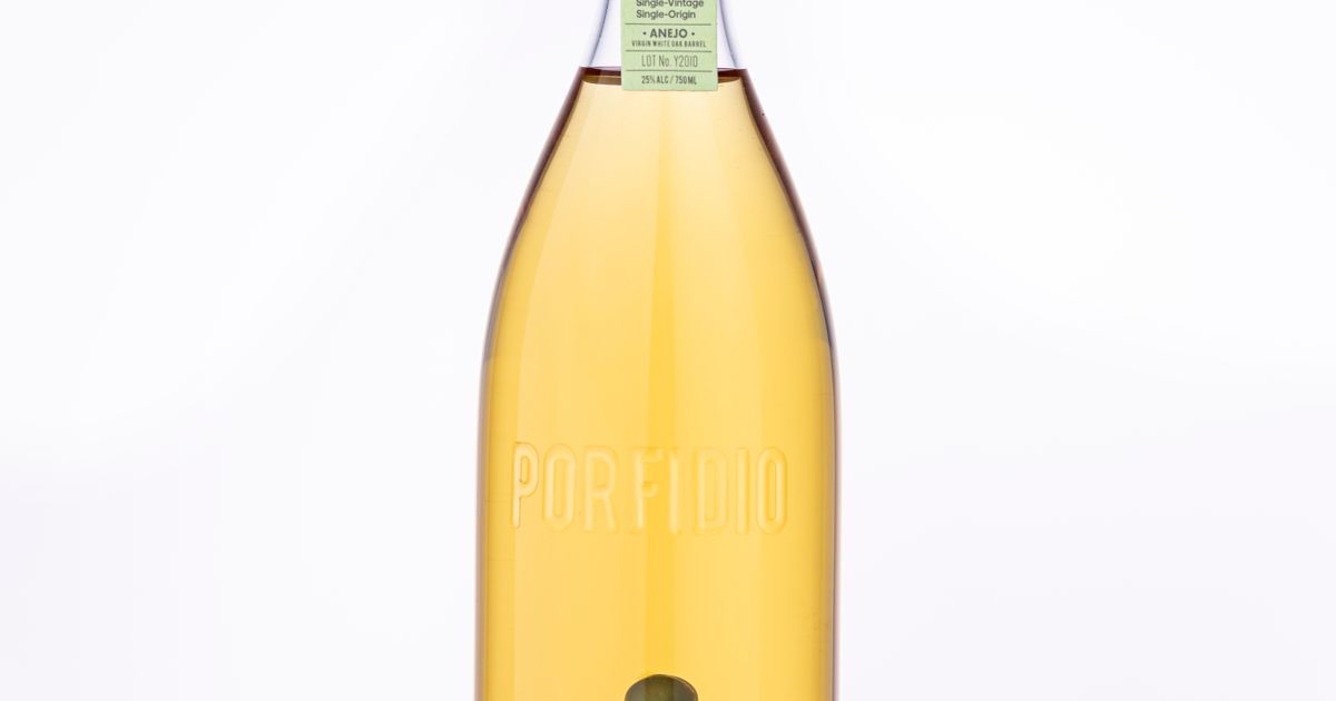 A bottle of tequila with a cactus design on a white background.
