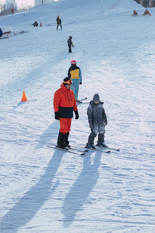 Father and Child on Skis on Winter Vacation