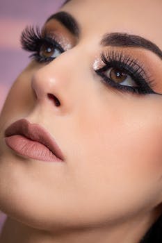 Close-up of a woman's elegant makeup, featuring bold lashes and defined eyeliner.