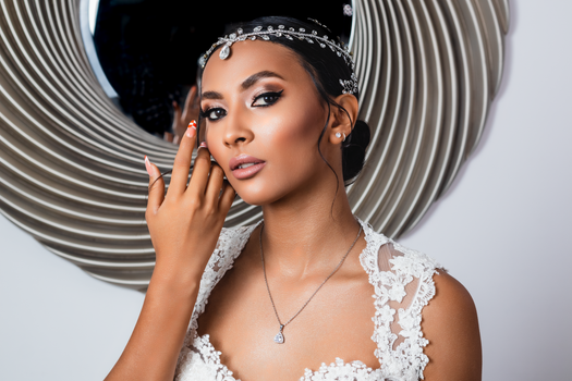 Stunning portrait of an elegant woman with diamond jewelry and intricate headpiece.