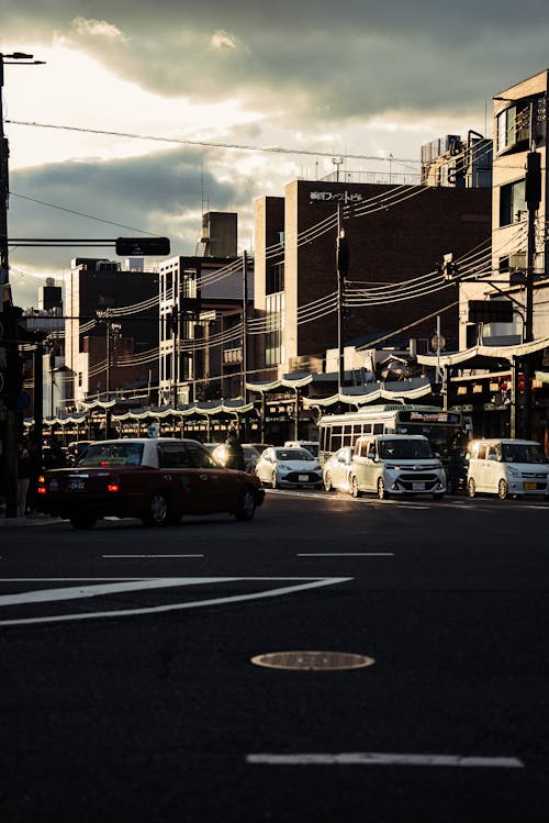 Clouds over Street with Cars in Town