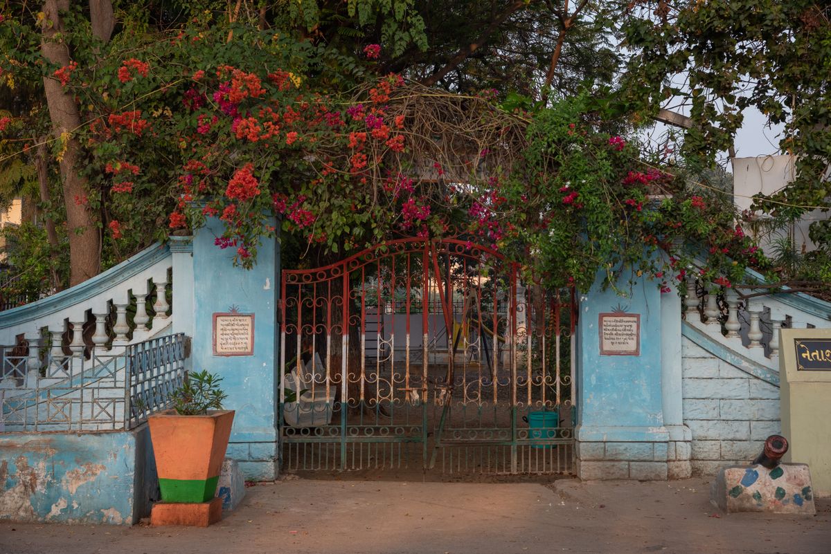 Closed garden gate with flowers representing healthy boundaries after infidelity and betrayal