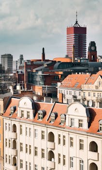 A vibrant urban cityscape of Poznań showcasing a blend of historic and modern architecture.