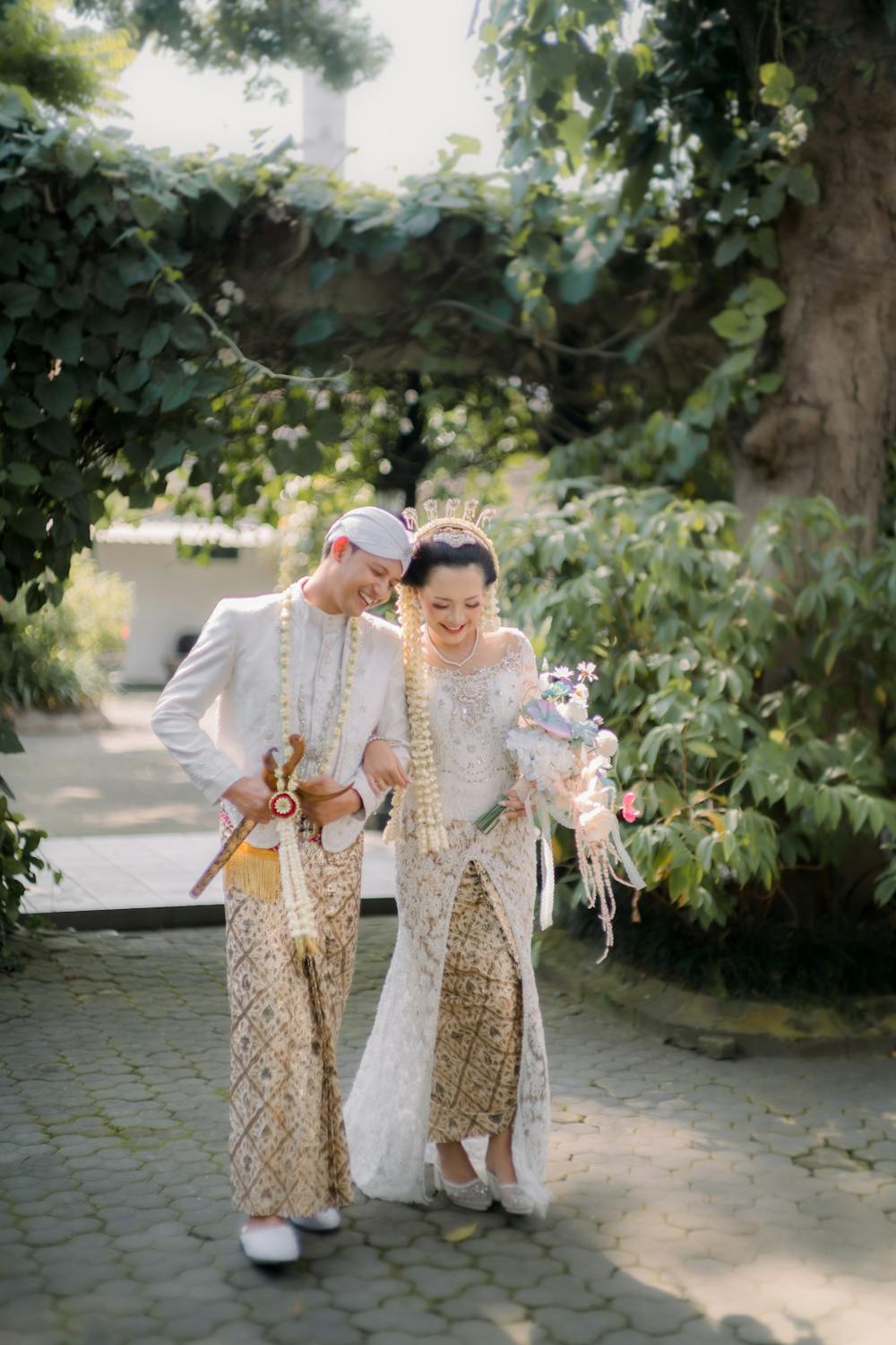 Couple in Traditional Javanese Wedding Clothes in a Park · Free Stock Photo