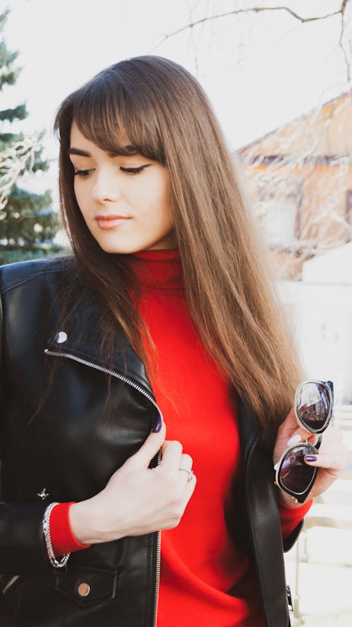Woman in Red Turtleneck and Leather Jacket