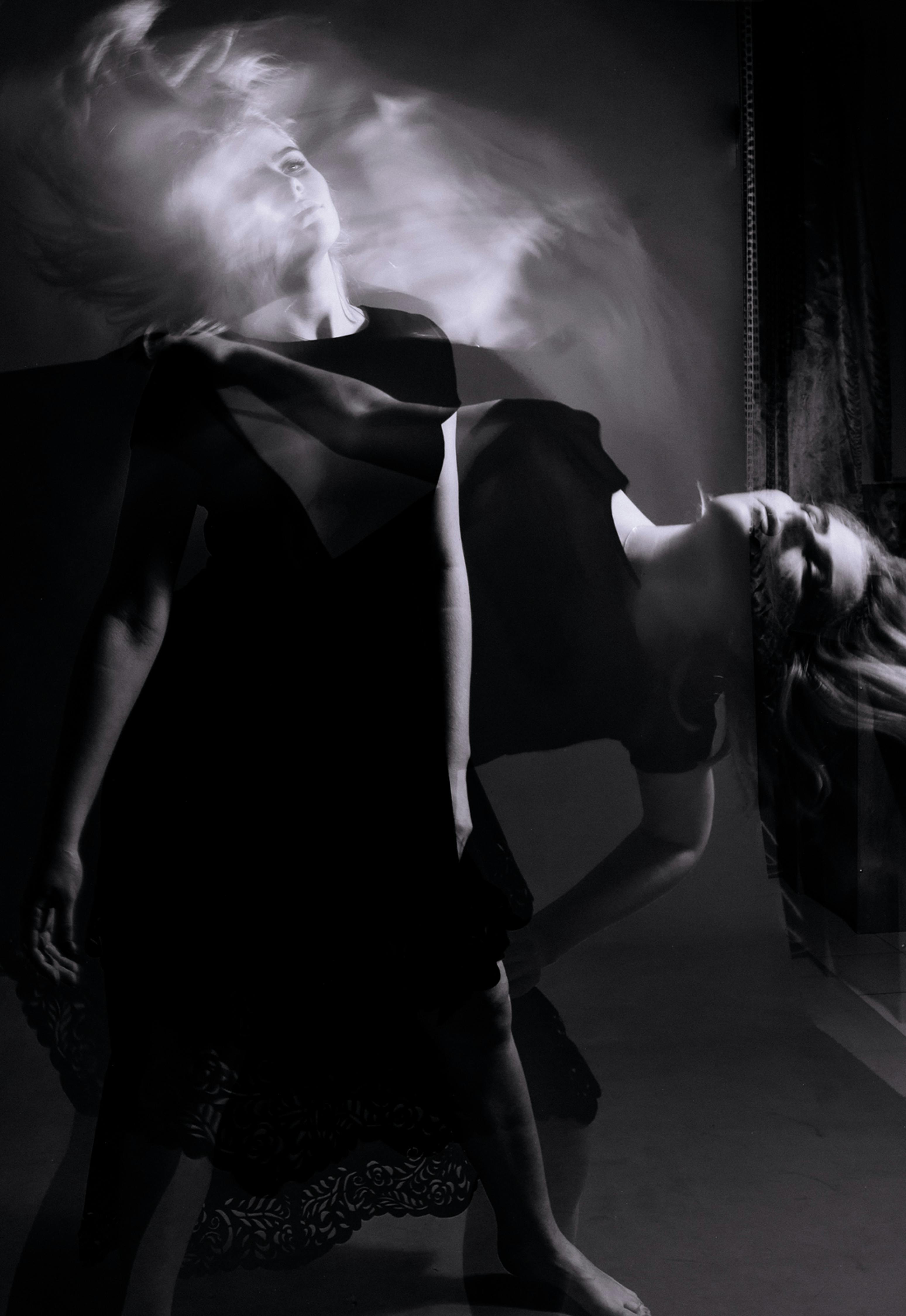 Creative black and white portrait showcasing dance movement through double exposure technique.
