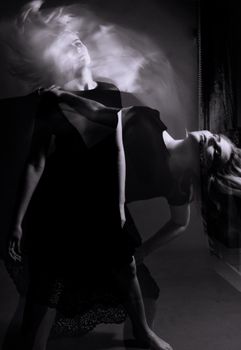 Creative black and white portrait showcasing dance movement through double exposure technique.