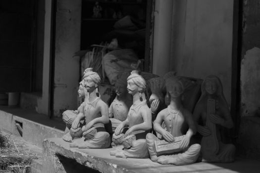 Black and white photo of monochrome musician sculptures capturing artistic expressions.